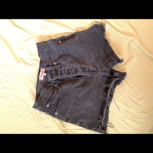 Madewell high wasted faded black denim shorts. Size 25. Button up.